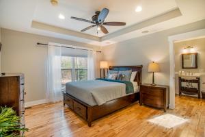a bedroom with a bed and a ceiling fan at Borrowed Thyme in Saugatuck