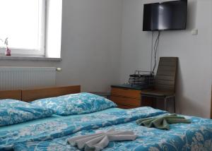 Posteľ alebo postele v izbe v ubytovaní Pension Sara