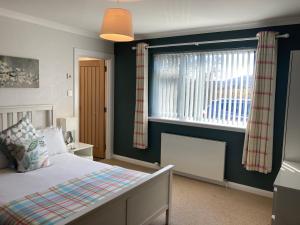 Postel nebo postele na pokoji v ubytování Ballintoy B&B IsleofSkye