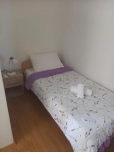 En eller flere senger på et rom på Guest house Janja Ostojic