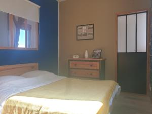 a bedroom with a bed and a window at O'3 PORTS in Le Tréport
