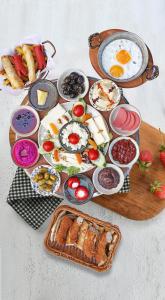 a table topped with different types of breakfast foods at Ethnica Suites in Istanbul