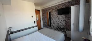 Postel nebo postele na pokoji v ubytování Hotel Au Spatial