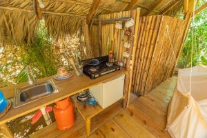 an interior view of a kitchen in a tiny house at Casita de Madera Encuentro in Bombita