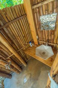 an overhead view of a bathroom with a sink and a window at Casita de Madera Encuentro in Bombita