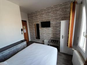 TV a/nebo společenská místnost v ubytování Hotel Au Spatial