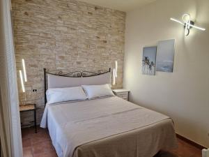 Postel nebo postele na pokoji v ubytování Masseria Casale Dei Fornici