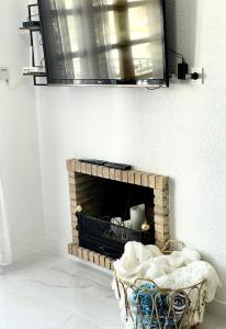 a brick fireplace with a mirror on the wall at Villamartin Plaza No 154 in Orihuela