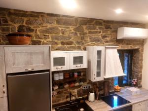 A kitchen or kitchenette at by karakas Λίθινο
