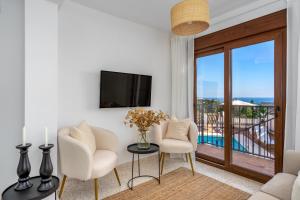 A television and/or entertainment centre at Luxurious villa with pool in La Cala by Costarentals - Ref 53