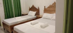 Postel nebo postele na pokoji v ubytování Rabang Traveller's Inn