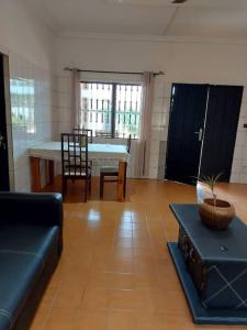 a living room with a couch and a table at Villa 28 in Lomé