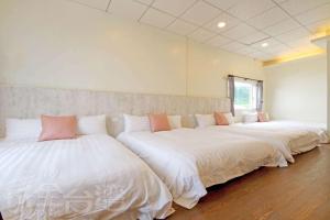 Giường trong phòng chung tại Lu Dao Homestay
