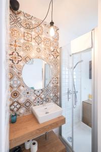 a bathroom with a sink and a mirror at Rooms lopwi Old town Ground floor in Zadar