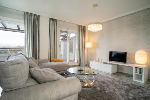 A seating area at El Lago de Los Arqueros 2 bedrooms penthouse en Benahavis