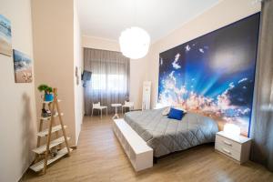 A bed or beds in a room at Holidays Lecce