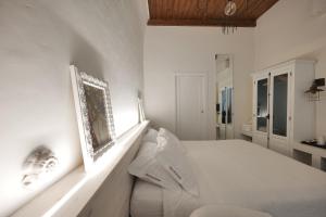 A bed or beds in a room at Dimora San Giuseppe