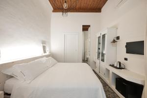 A bed or beds in a room at Dimora San Giuseppe