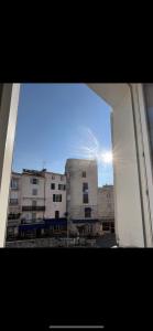 a view of a building from an open window at Coeur du Vieil Antibes in Antibes