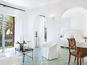 A seating area at Caramel, A Grecotel Resort to Live