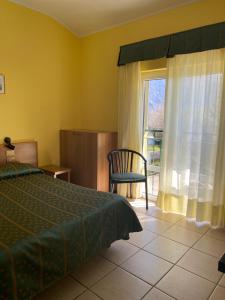 Postel nebo postele na pokoji v ubytování Hotel Del Fiume
