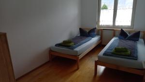 Postel nebo postele na pokoji v ubytování Dimai House No 31 Dornbirn Messe