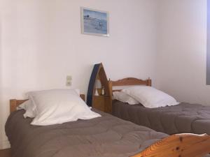 Posteľ alebo postele v izbe v ubytovaní le clos du phare bleu