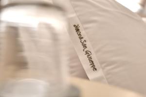 A bed or beds in a room at Dimora San Giuseppe
