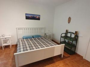 Postel nebo postele na pokoji v ubytování Finca la fortaleza