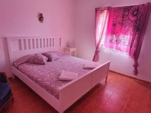 Postel nebo postele na pokoji v ubytování Finca la fortaleza