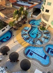 an overhead view of a pool at a resort at Apartamento no Fiori Prime in Caldas Novas