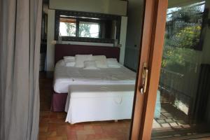 Postel nebo postele na pokoji v ubytování La casa nella Macchia