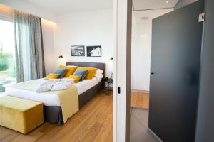 מיטה או מיטות בחדר ב-Unìco Boutique Hotel d'Arte