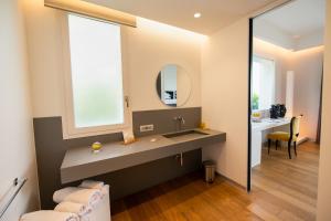 תמונה מהגלריה של Unìco Boutique Hotel d'Arte במונדלו
