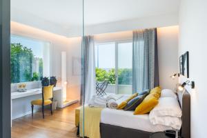 מיטה או מיטות בחדר ב-Unìco Boutique Hotel d'Arte