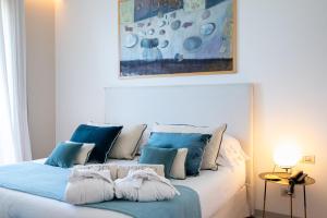 מיטה או מיטות בחדר ב-Unìco Boutique Hotel d'Arte