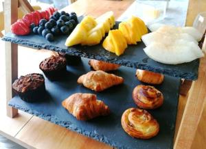 a tray of different types of pastries on a table at South View House in Waterlooville