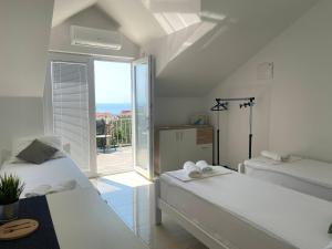 Postel nebo postele na pokoji v ubytování Studio apartmani Alex Doll