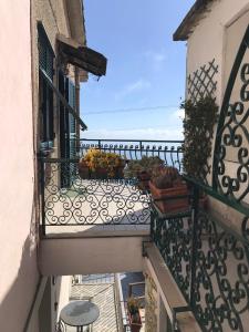 a balcony of a building with flowers on it at casa fiorella in San Bernardino