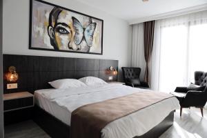A bed or beds in a room at SAR-PER Hotel