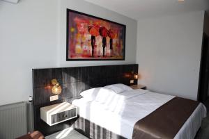 A bed or beds in a room at SAR-PER Hotel