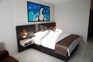 A bed or beds in a room at SAR-PER Hotel
