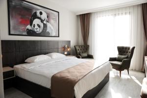 A bed or beds in a room at SAR-PER Hotel