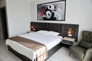 A bed or beds in a room at SAR-PER Hotel