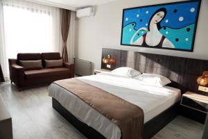 A bed or beds in a room at SAR-PER Hotel