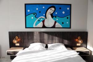 A bed or beds in a room at SAR-PER Hotel
