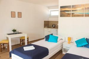 Postel nebo postele na pokoji v ubytování Studio apartmani Alex Doll