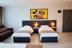 A bed or beds in a room at SAR-PER Hotel