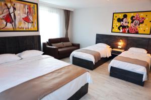 A bed or beds in a room at SAR-PER Hotel