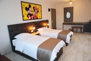 A bed or beds in a room at SAR-PER Hotel